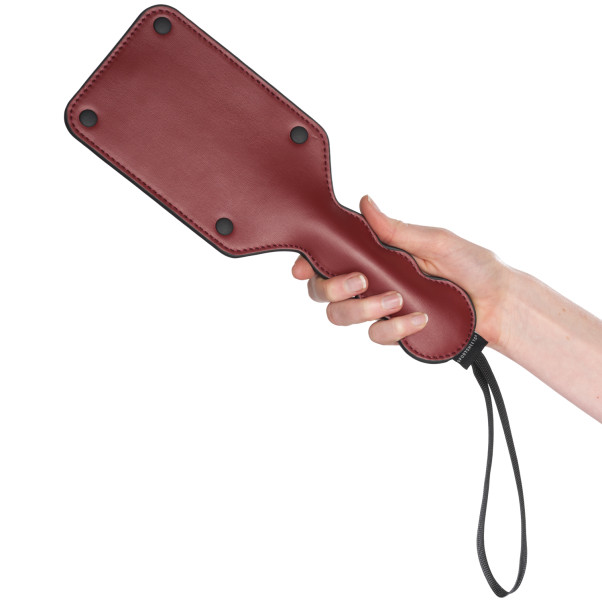 Sportsheets Saffron Square Paddle Produktbilde med hånd 50