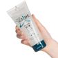 Just Glide Premium Silikonbasert Analglidemiddel 200 ml Produktbilde med hånd 50